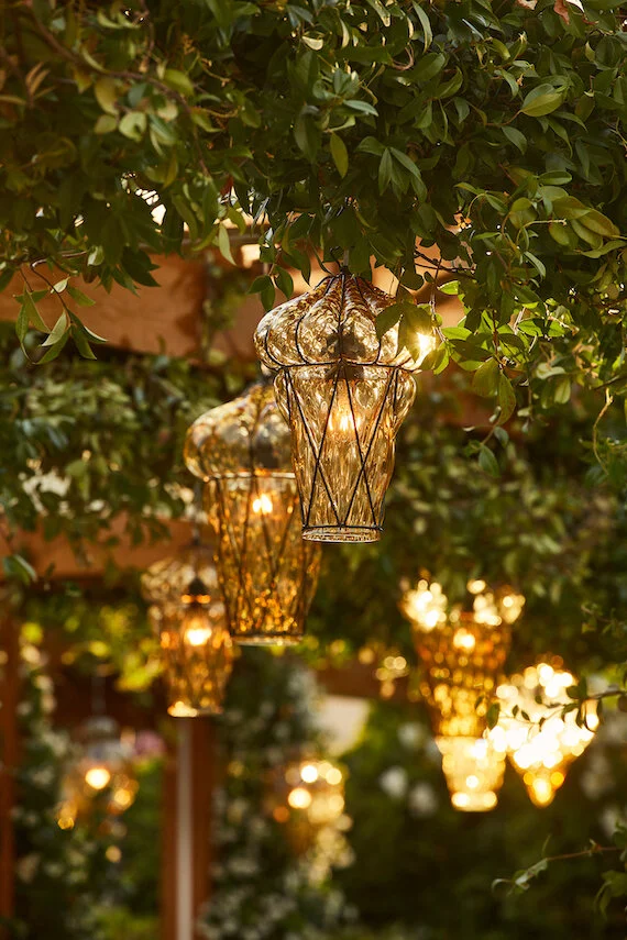 Elegant outdoor dining setup with decorative lantern lighting