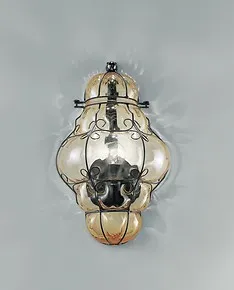 Sconce in submerged amber color rough steel finishes